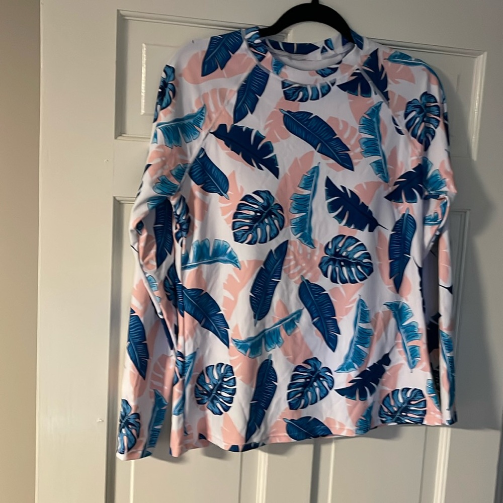 Size large, swim top with built-in bra,fits snug, long sleeves, tag attached
